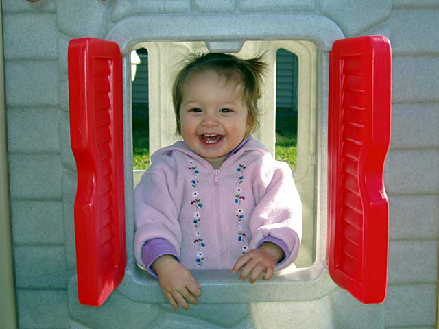 Shannon in playhouse window